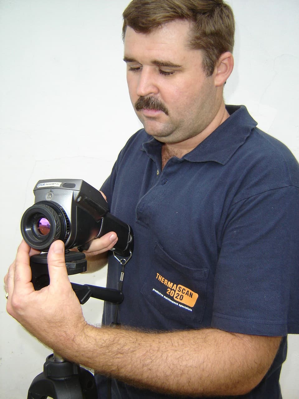 Thermascan 2020 technician using a FLIR thermal imaging camera